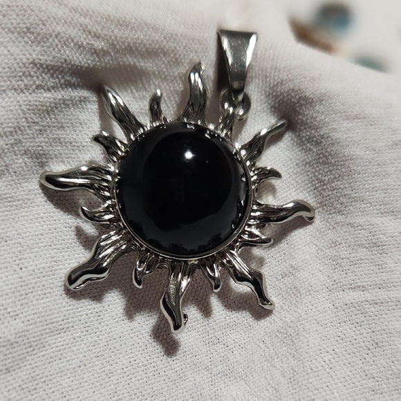 Jewelry - SILVER SUN PENDANT WITH BLACK CENTER.